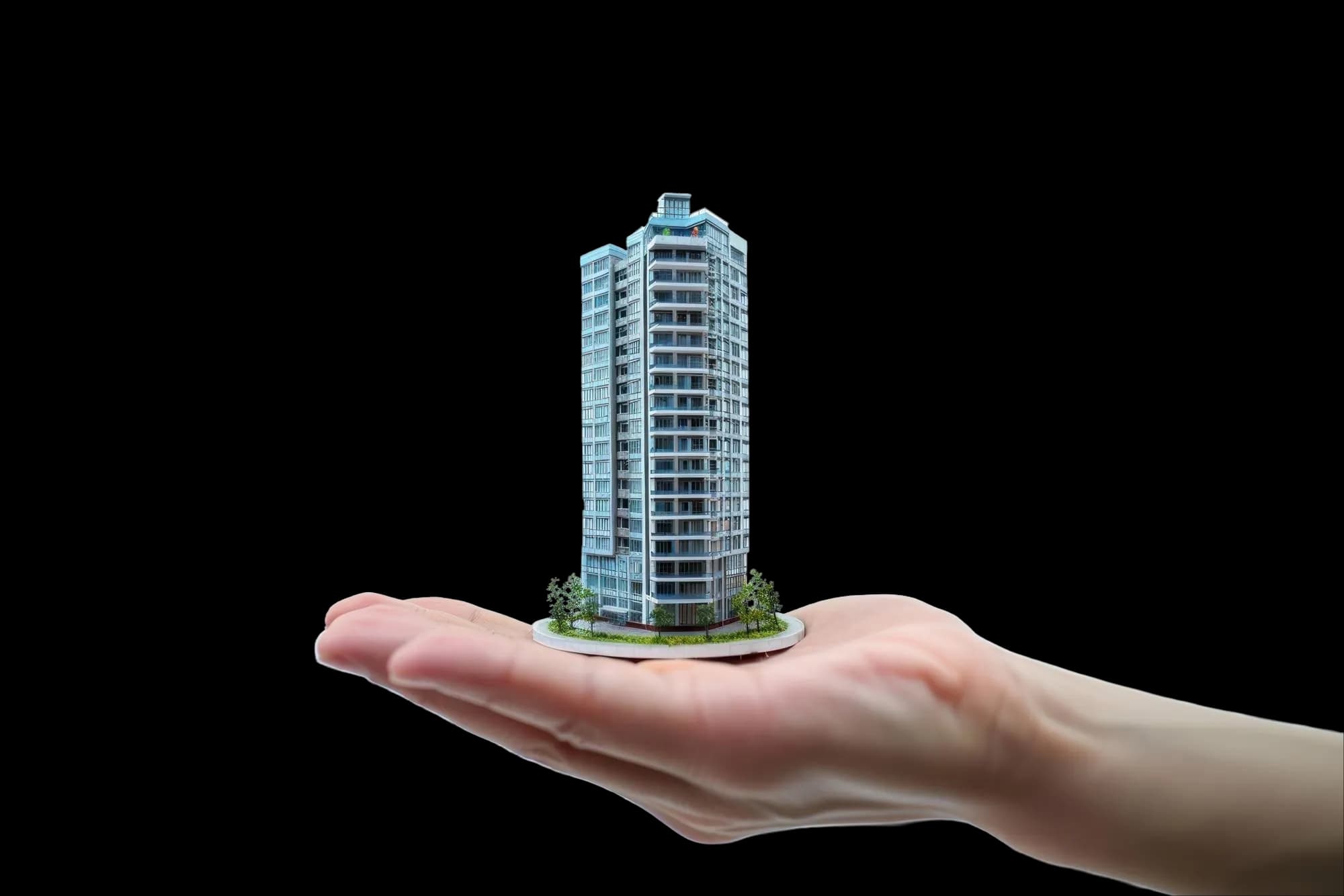 Building held in a hand